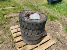 NEW (4) 10. X 16.5 SOLID DEMO TIRES ON RIMS SKID STEER ATTACHMENT