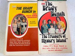 Group of 4 Brady Bunch and Partridge Family Paperback Books