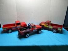 three vintage Tonka trucks