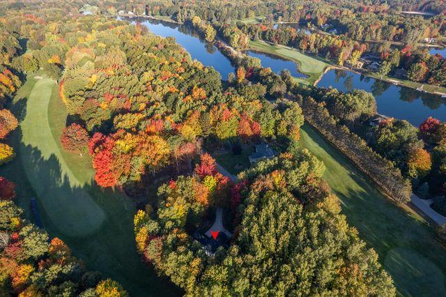 Experience the Best Resort Lifestyle: Great Homesite in Canadian Lakes, Michigan!