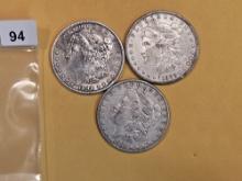Three Morgan Silver dollars