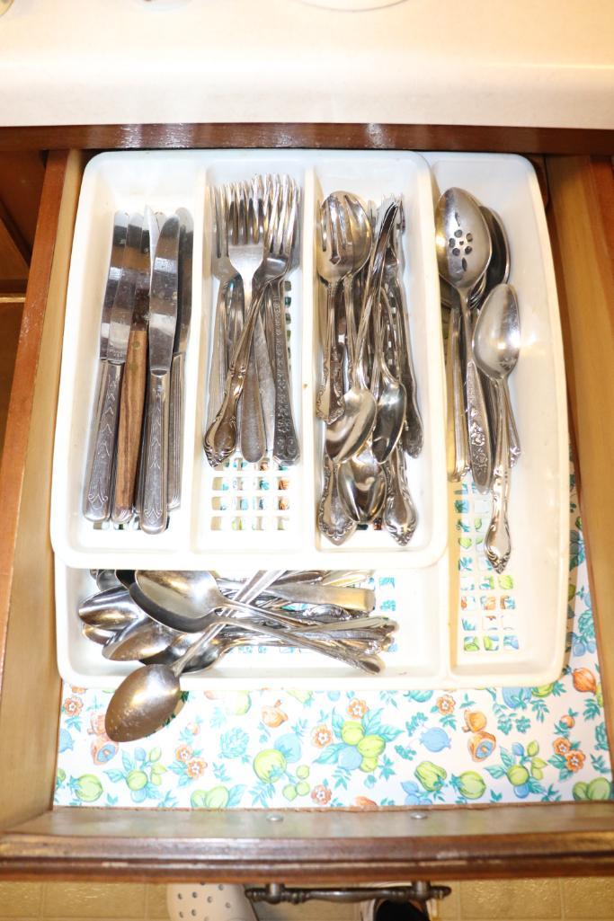 Contents of kitchen cabinets to include silverware, bakeware, Tupperware, etc.