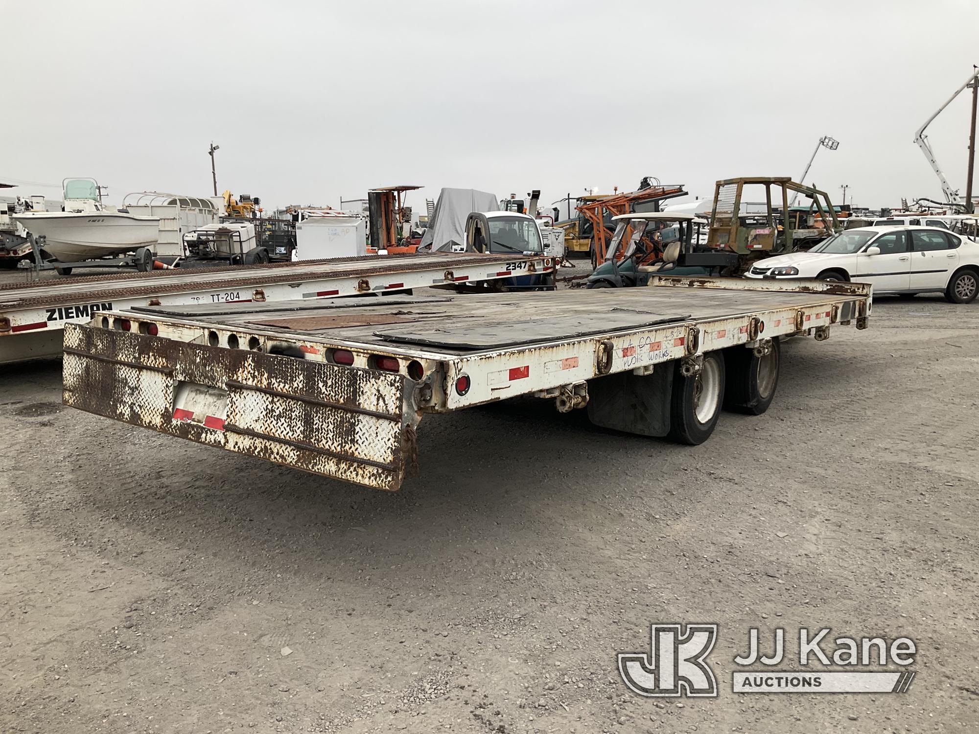 (Jurupa Valley, CA) 2003 Monroe Towmaster T/A Tagalong Flatbed Trailer Trailer Length: 24ft 8in, Tra