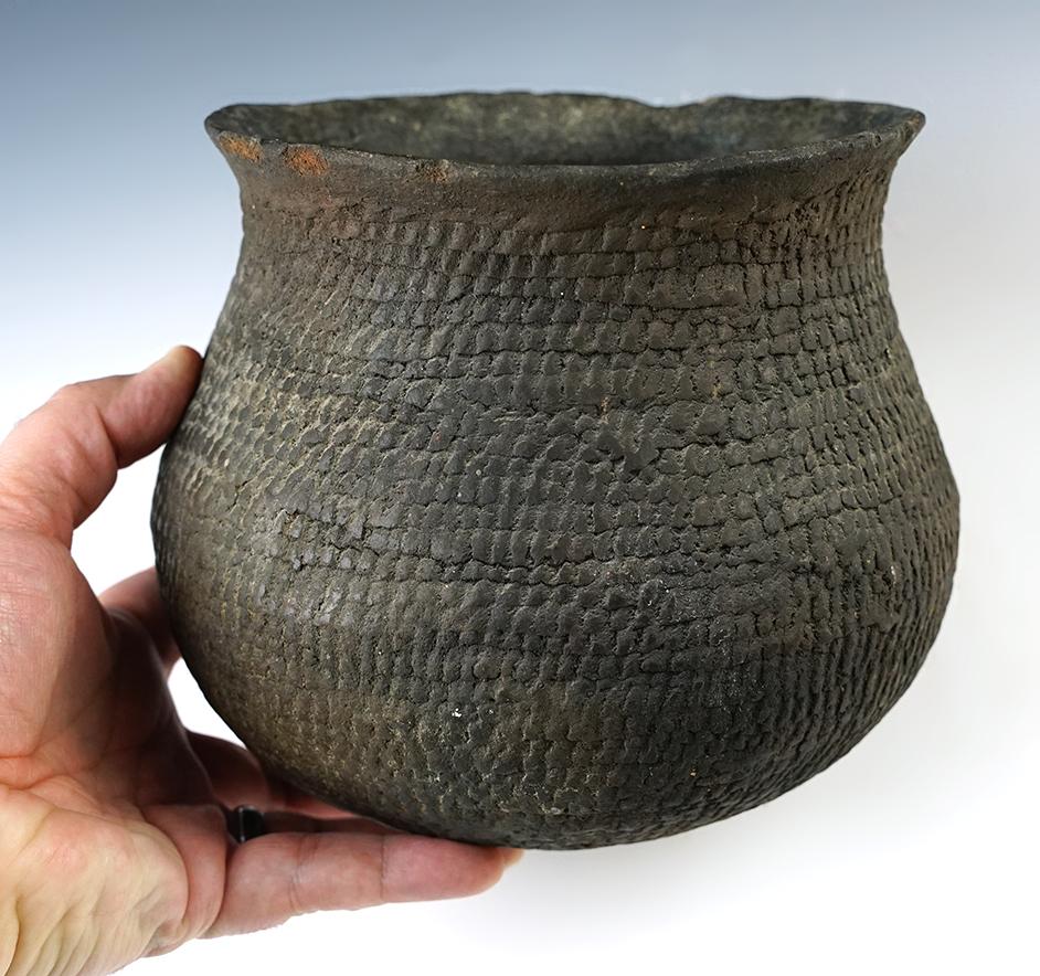 6 1/4" tall corrugated pottery vessel found in New Mexico. A few rim chips and a pressure crack.