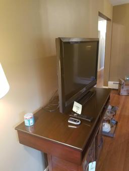 Vizio 38 inch flat screen tv with Phillips dvd player and mahogany table top pigeon hole