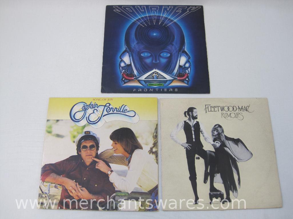 Three Vinyl Record Albums including Fleetwood Mac: Rumours, Journey: Frontiers and Captain &