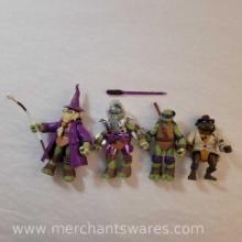 Four Donatello Teenage Mutant Ninja Turtles Figures including 2011 Merlin Wizard Donatello, 1990
