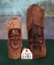 Two African Men Carved on Tree Branches