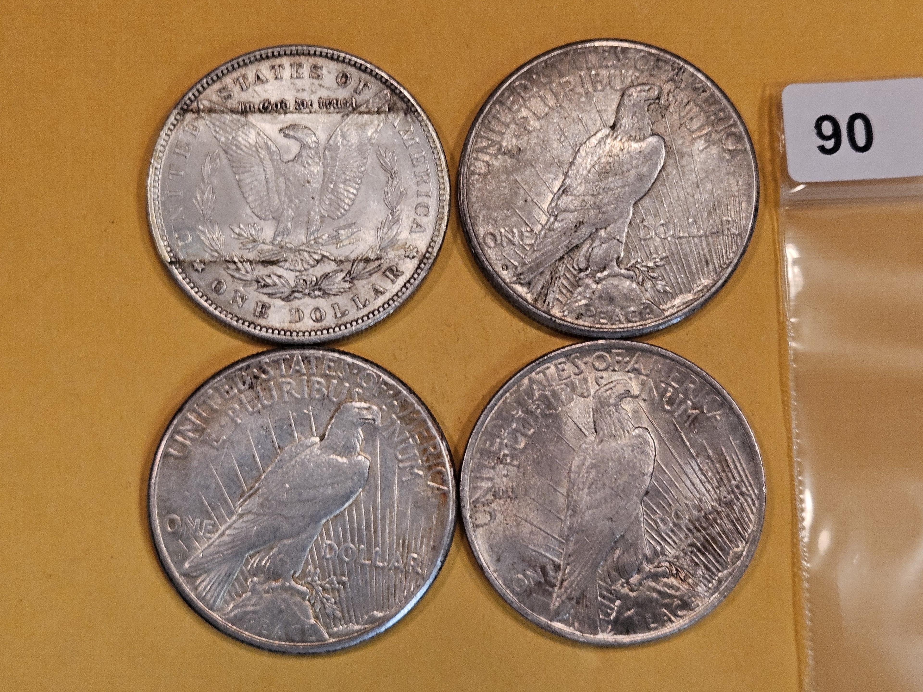 Four mixed Silver Dollars