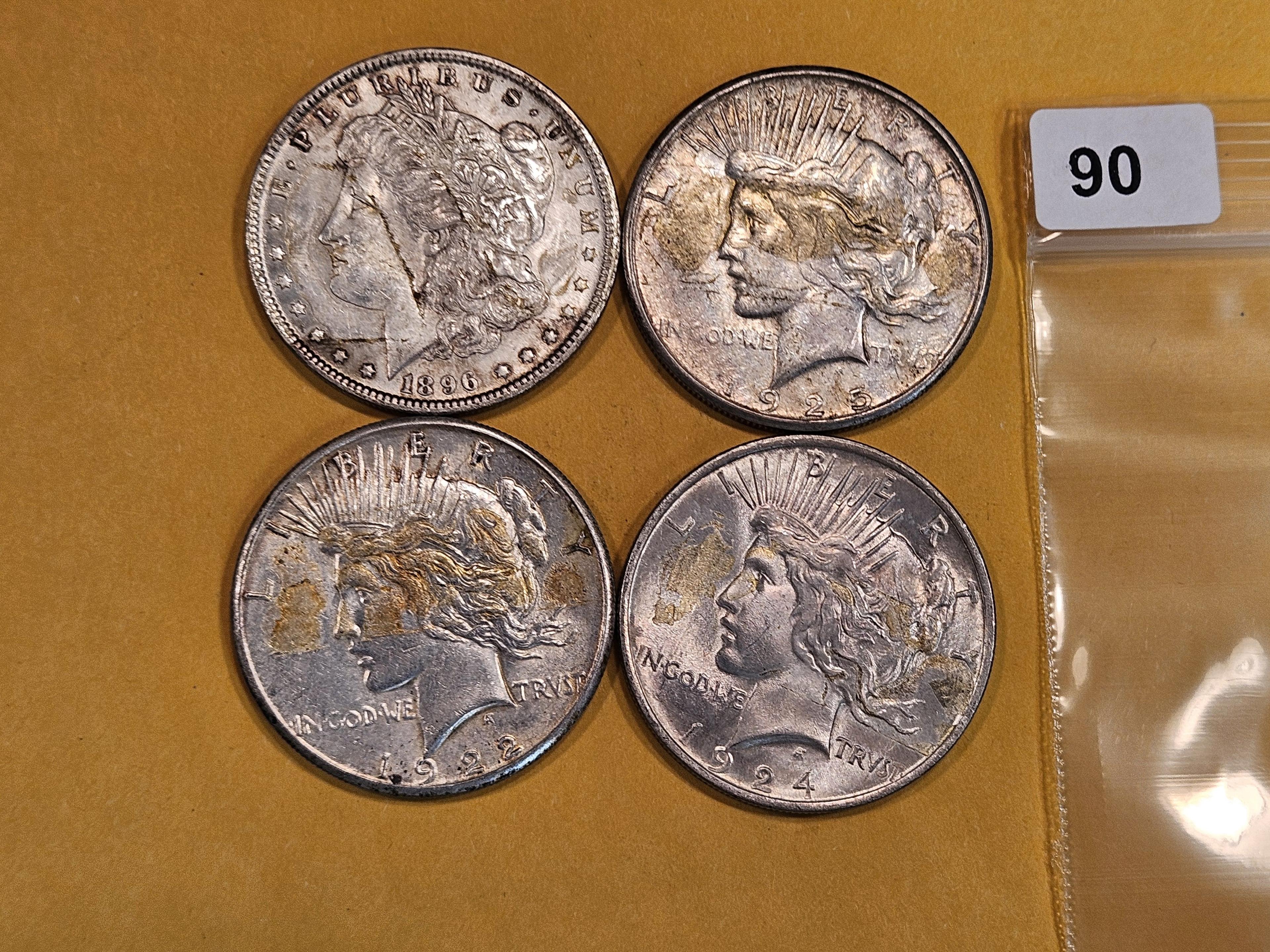 Four mixed Silver Dollars