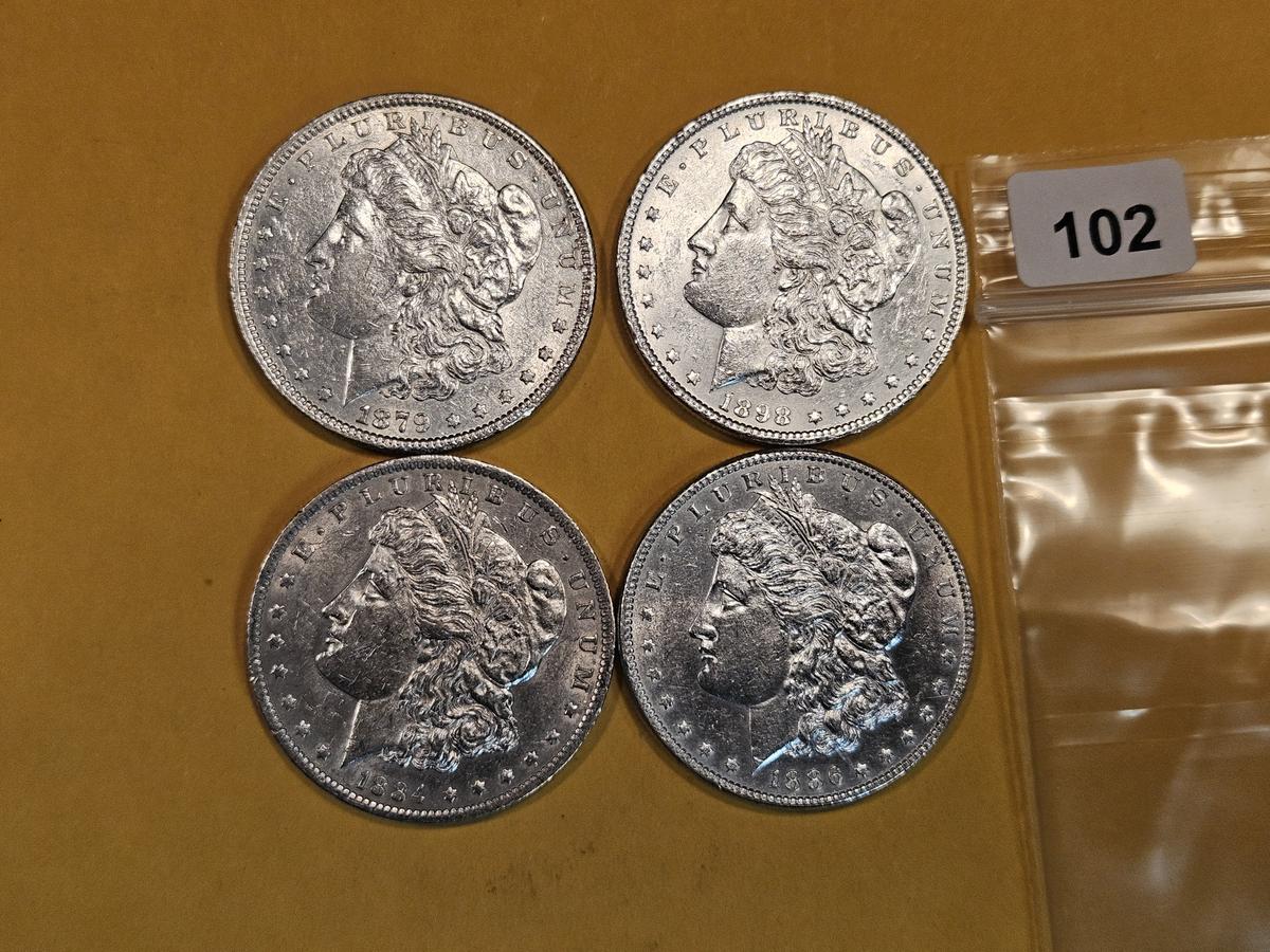 Four mixed Morgan Silver Dollars