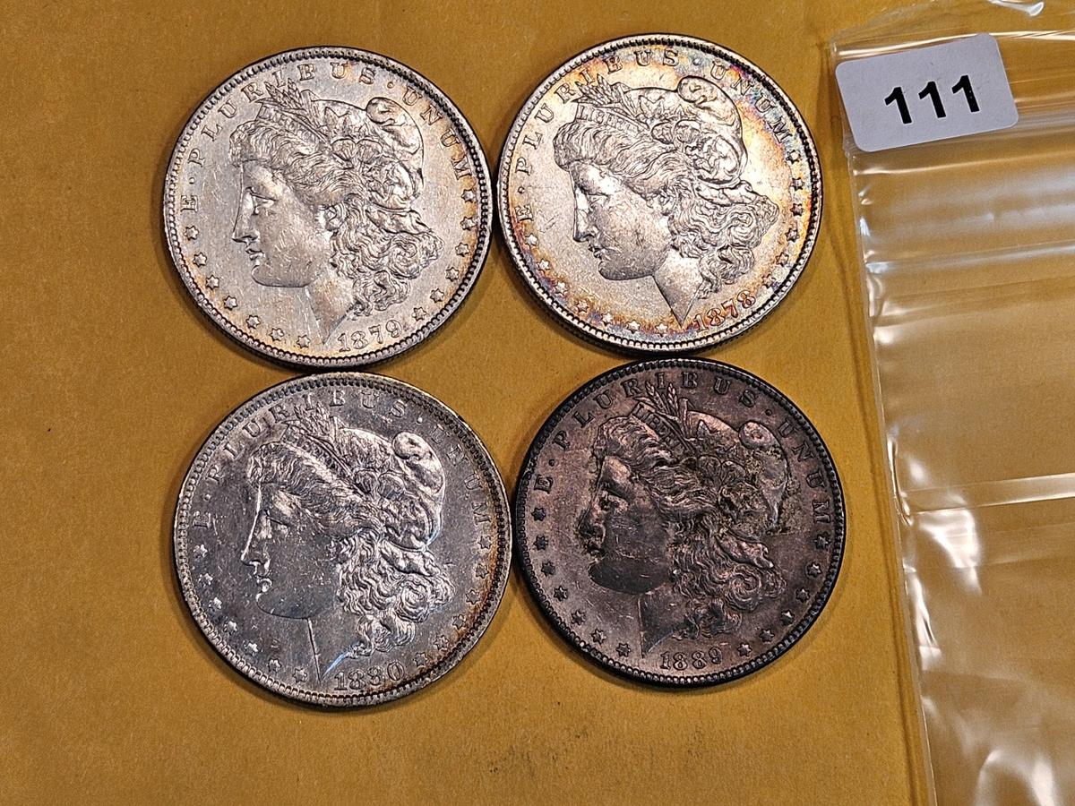 Four mixed Morgan Silver Dollars