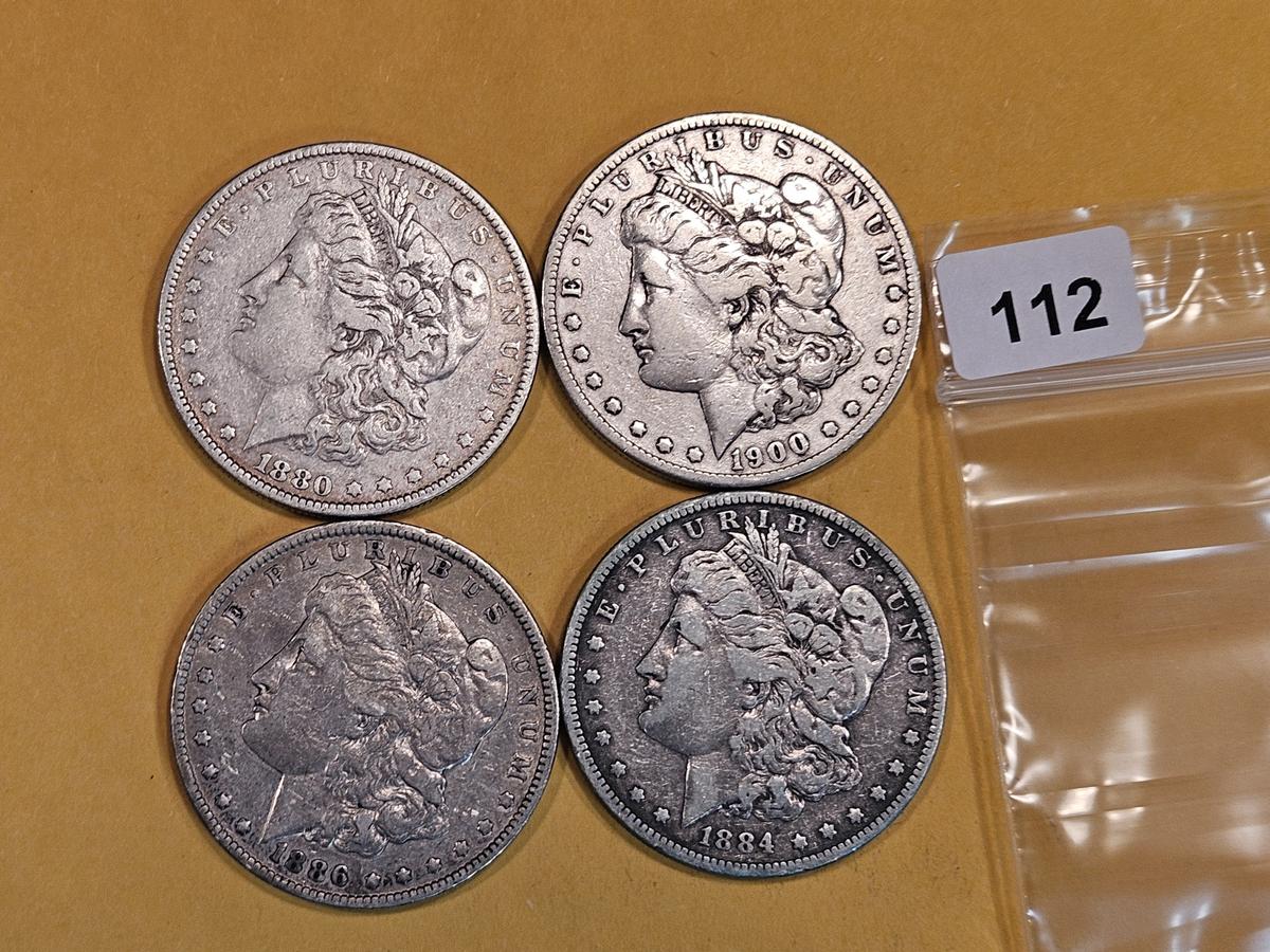 Four mixed Morgan Silver Dollars