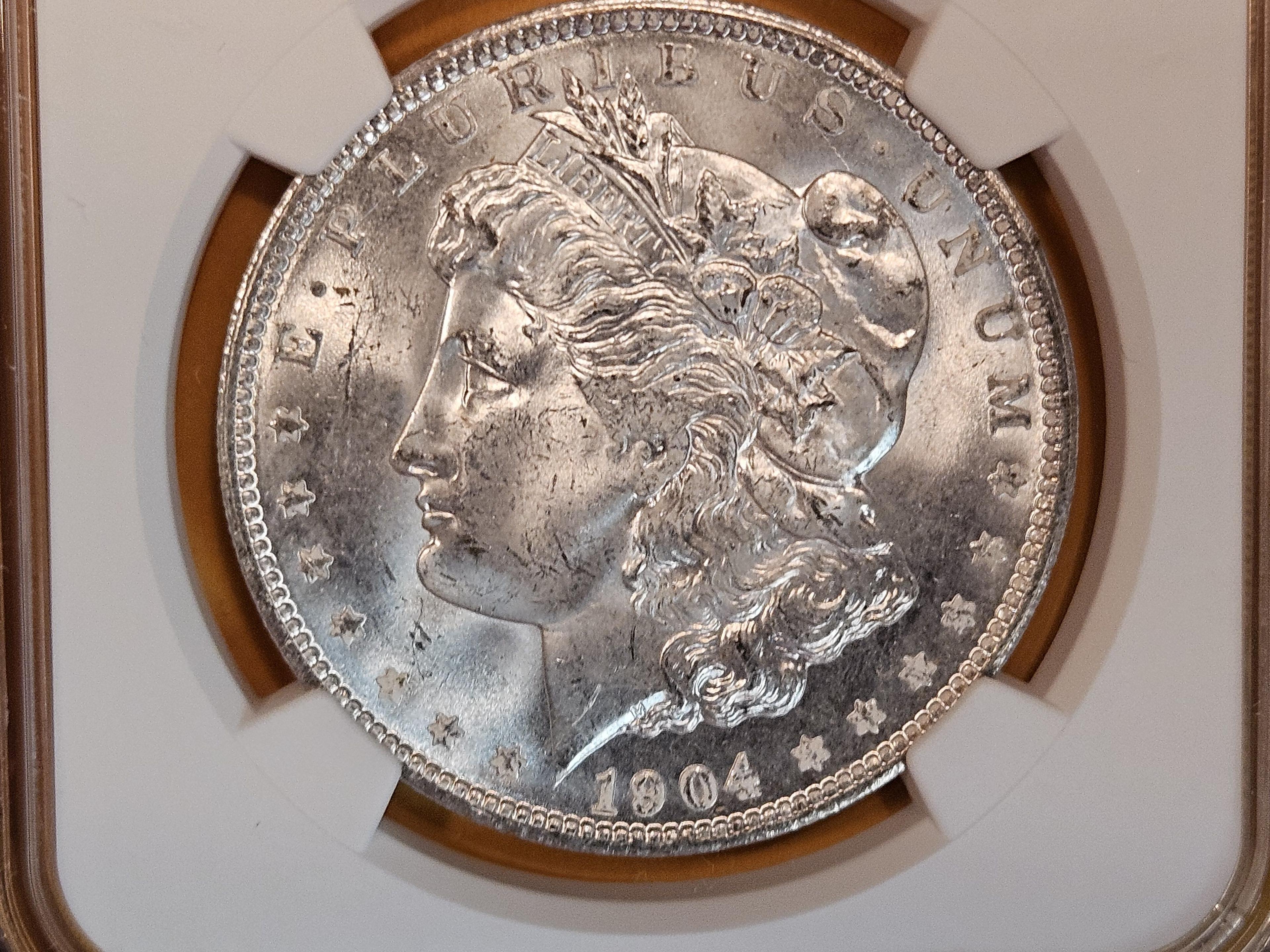 NGC 1904-O Morgan Dollar in Mint State 64