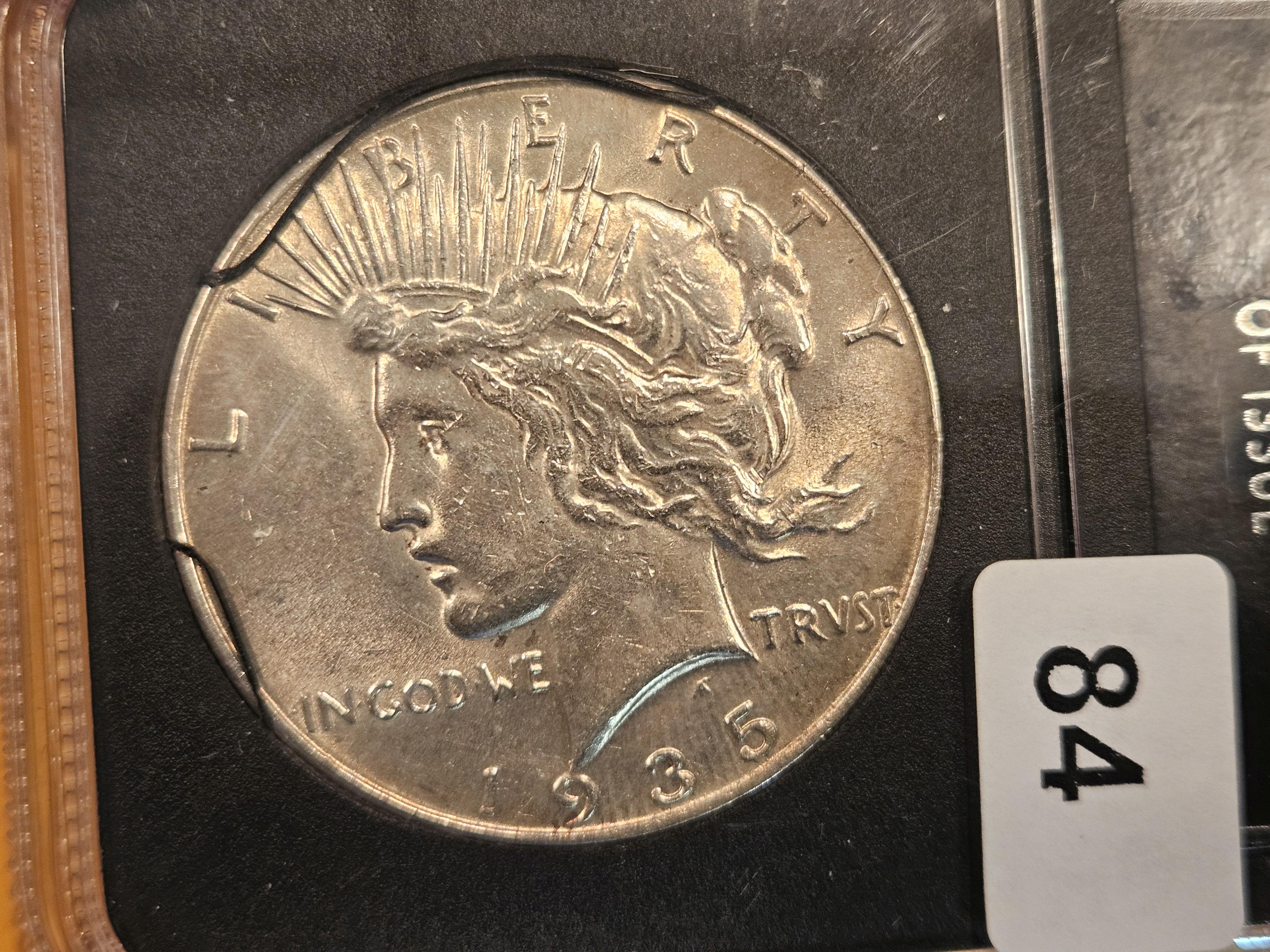 1935 Peace Dollar in About Uncirculated