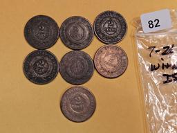 Group of seven 2-cent pieces