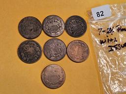 Group of seven 2-cent pieces