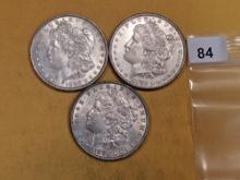 Three Morgan silver dollars