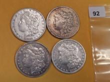 Four mixed Morgan Silver Dollars