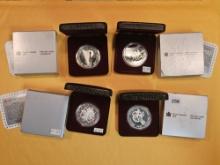 Four Canadian Proof or prooflike Silver Dollars