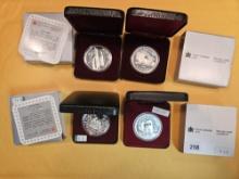 Four Canadian Proof or prooflike Silver Dollars