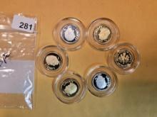 Six Silver Ronald Reagan dime-sized coins