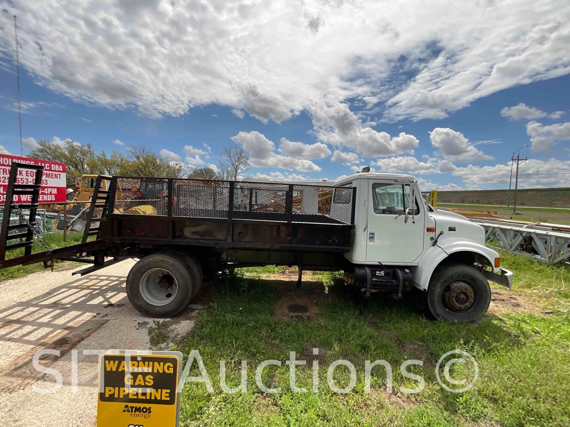 1998 InternationaL 4900 S/A Flatbed Truck w/ Ramps