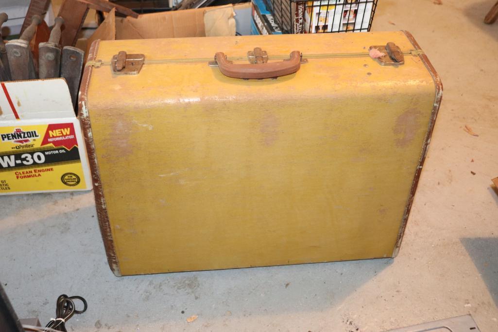Vintage suitcase, wooden shoes, shoe stretchers, and wooden shelves