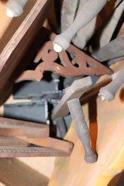 Vintage suitcase, wooden shoes, shoe stretchers, and wooden shelves