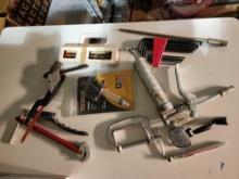 Box of miscellaneous tools. C clamp, small pipe wrench, etc.