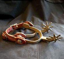 Western spurs, leather straps