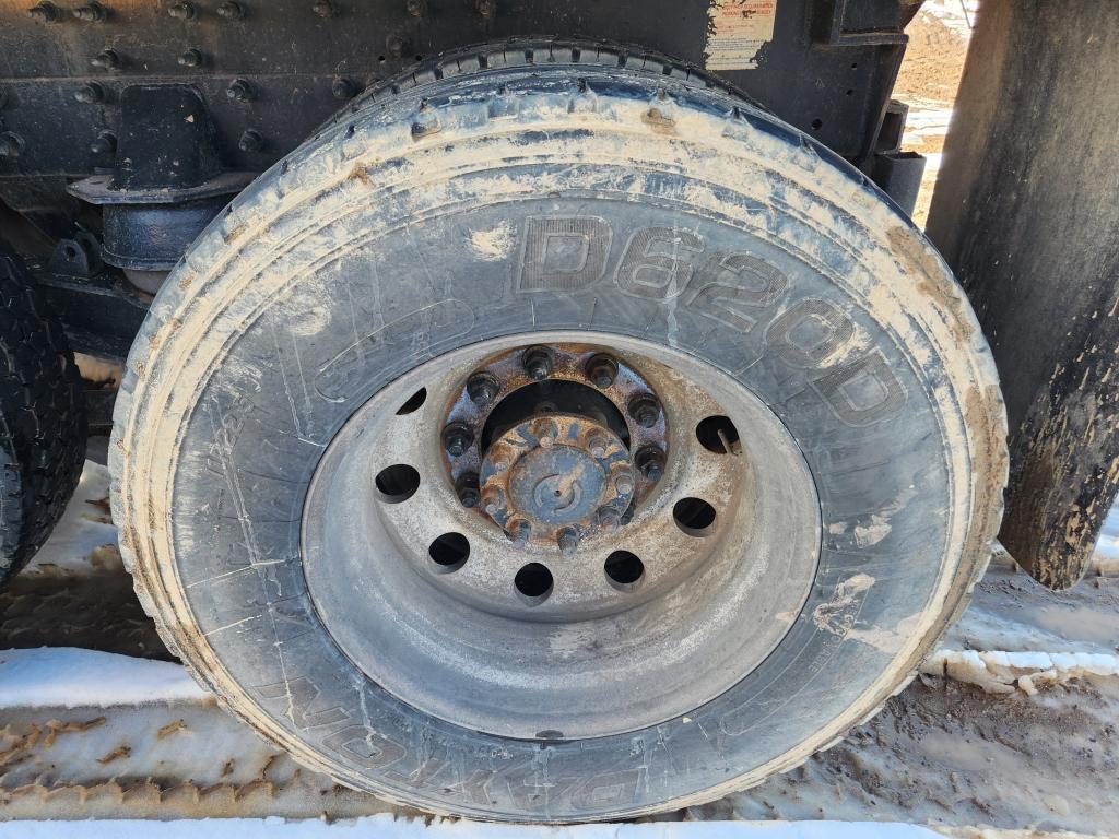 2014 Caterpillar Quad Axle Dump Truck