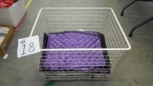 large metal basket with content, of various curtains, toewels and more