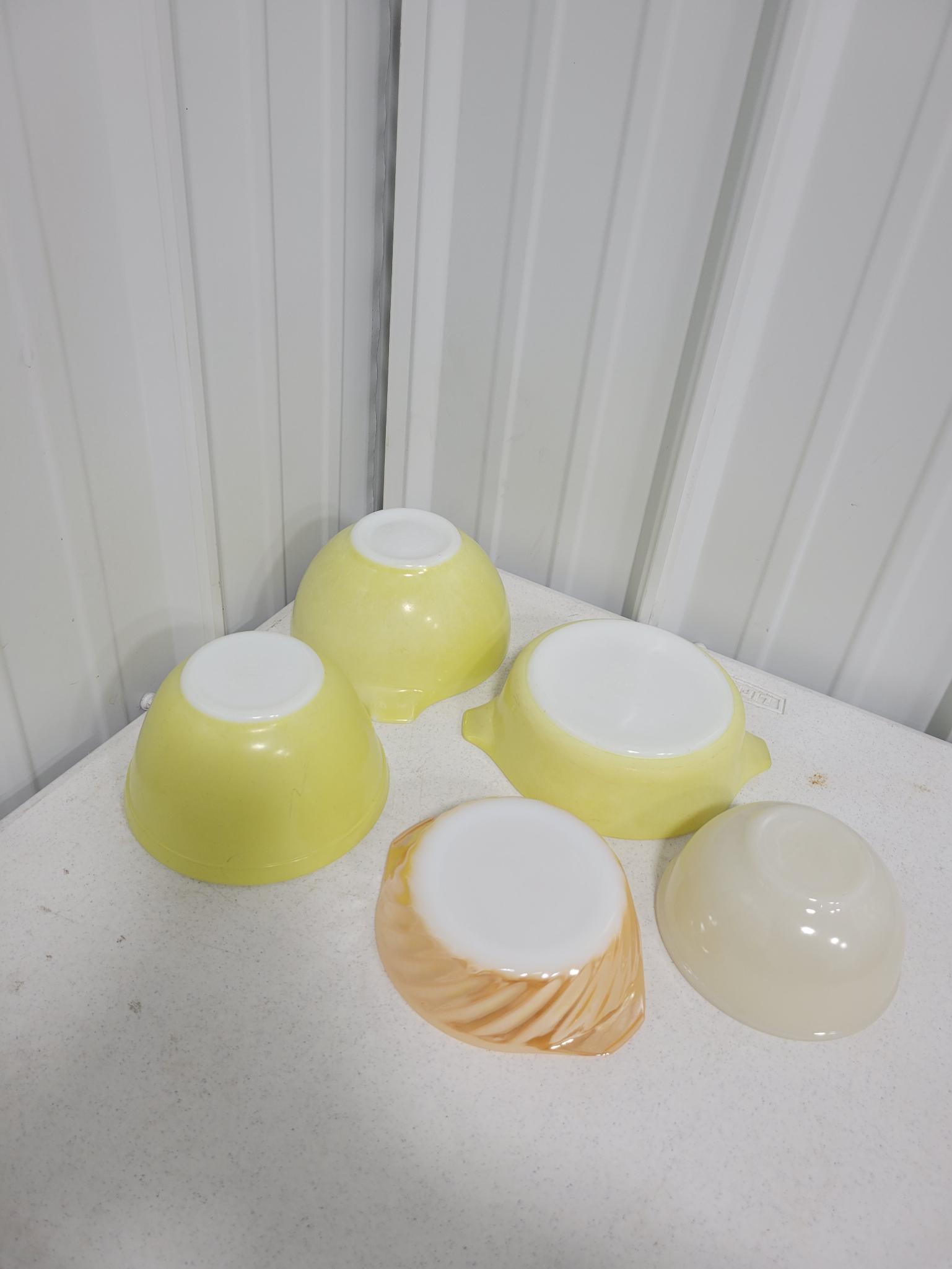 3 small yellow Pyrex bowls and 2 fire king bowls