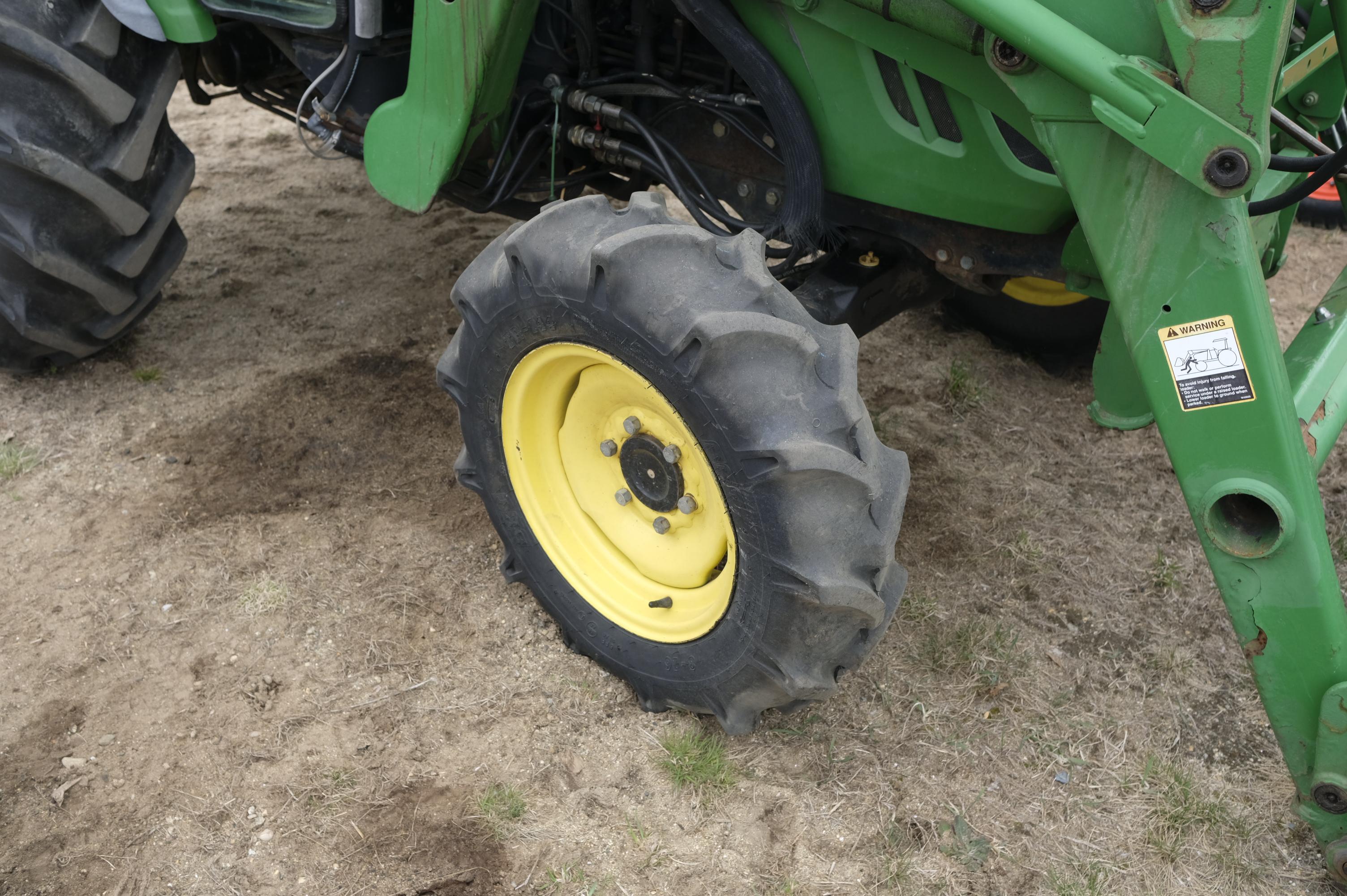 John Deere 4320 tractor with front bucket