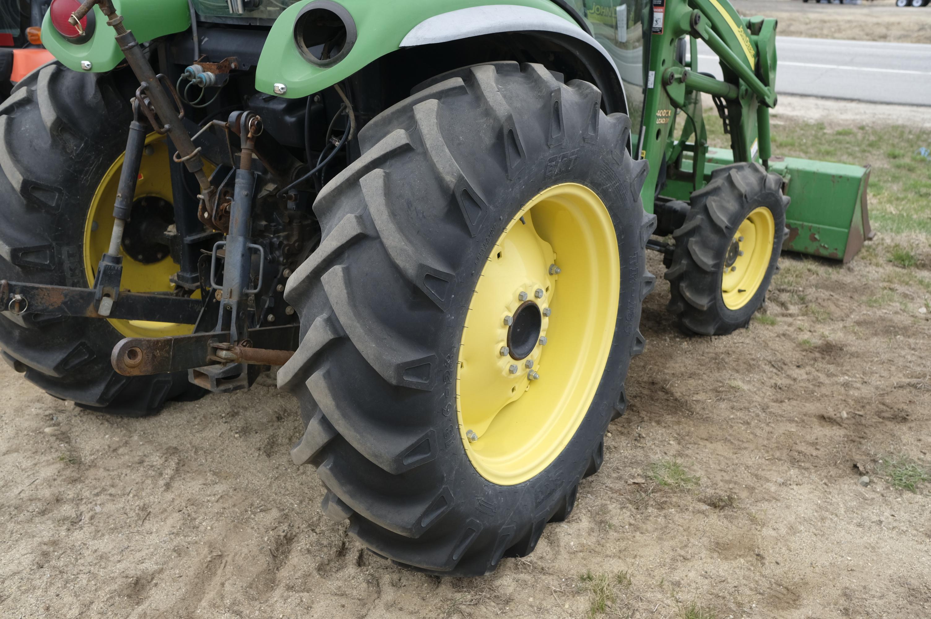 John Deere 4320 tractor with front bucket