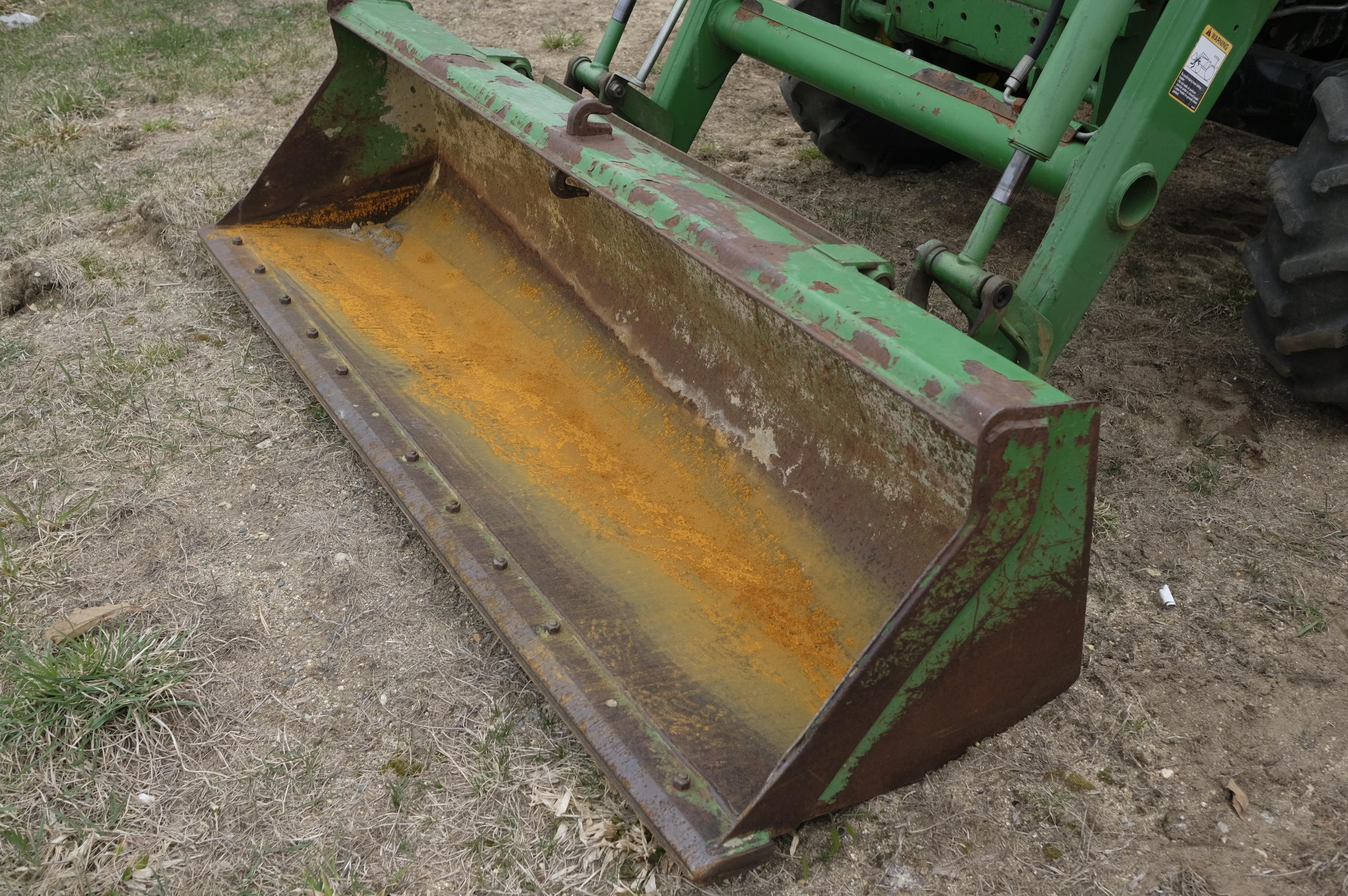 John Deere 4320 tractor with front bucket