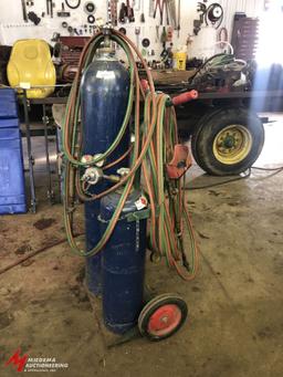 OXYGEN/ACETYLENE TANK CART WITH APPROX. 30' OF HOSE, GOGGLES, TORCH, AND REGULATORS (TANKS ARE BELIE