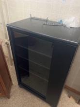 Black entertainment center with glass door S Basement