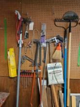 Assorted yard and hand tools.