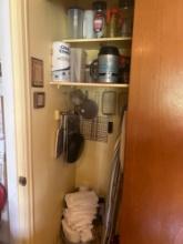 contents of kitchen pantry frying strainers, plasticware, ironing board and more