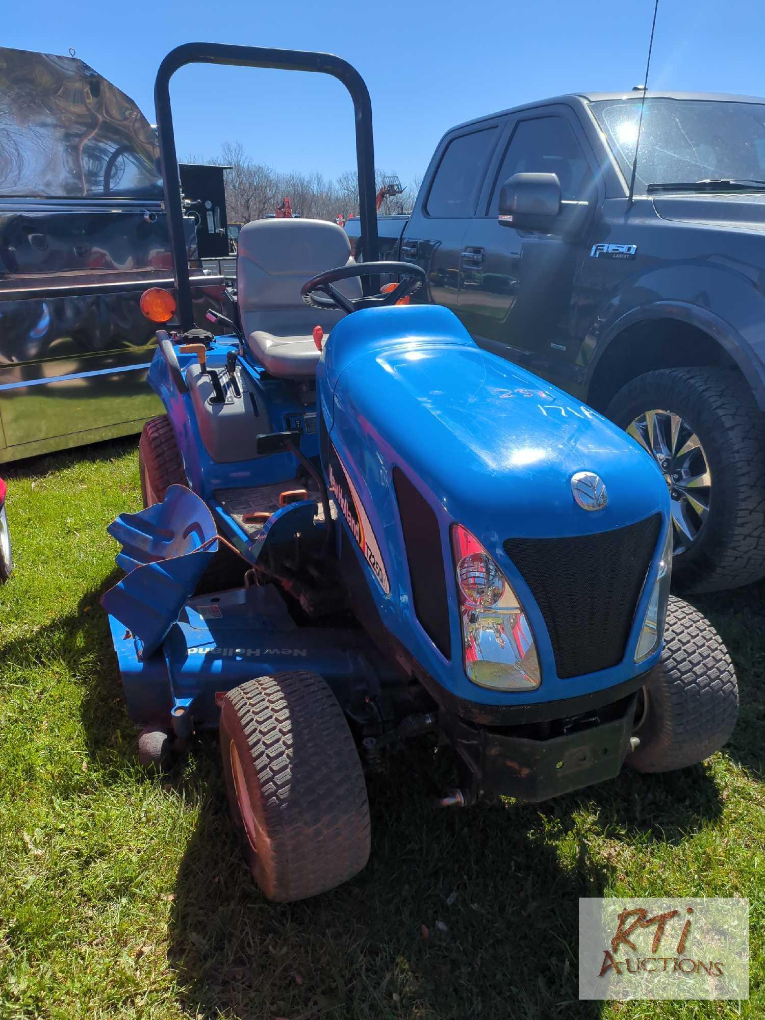 New Holland TZ25DA compact tractor, 60in belly mower, lift arms, PTO, HST, high/low range, 4WD, 210