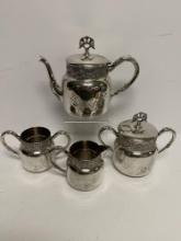 FOUR PIECE SILVER PLATE HAND CHASED TEA SET