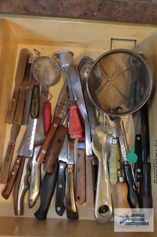 Drawer full of assorted knives. Sifters. Vintage ice cream scoop and Ice Ever pick