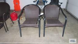 Pair of metal and wicker style chairs