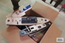 lot of plastic toy boats and accessories