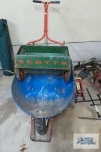 Scott's seeder and pneumatic tire wheelbarrow, wheelbarrow is bent