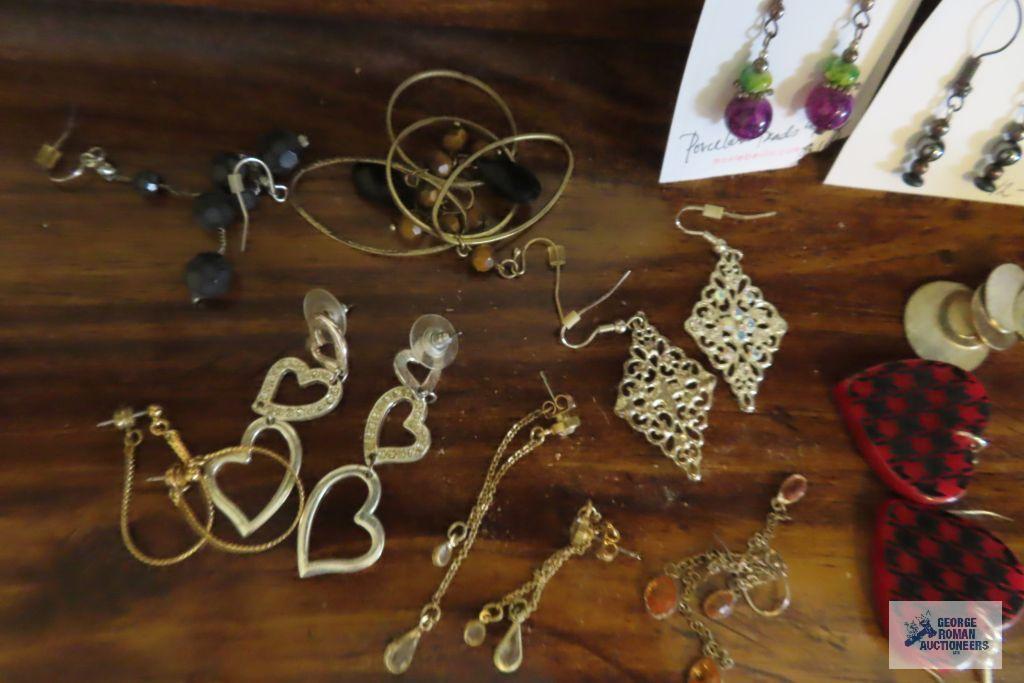 large assortment of earrings
