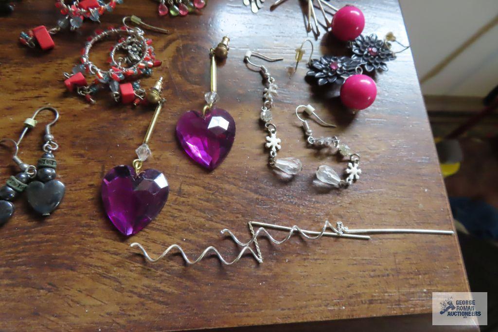 large assortment of earrings