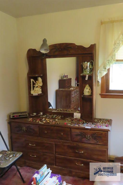 carved mirrored headboard, dresser with mirror and chest